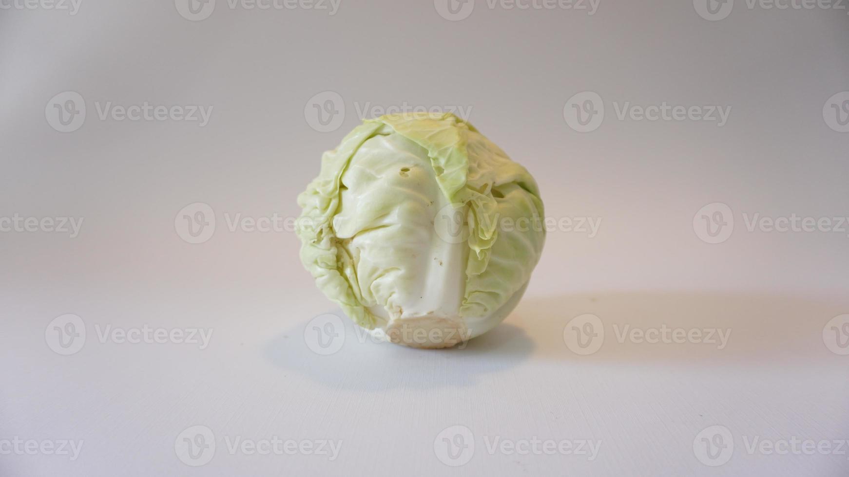 Fresh pointed white cabbage on white background. photo