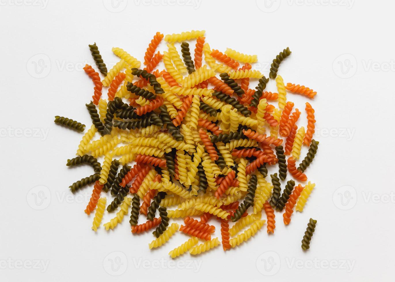 Raw pasta torti on white background. photo