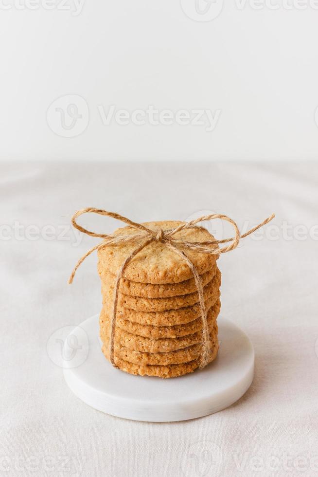 Oatmeal cookies on a marble stand photo