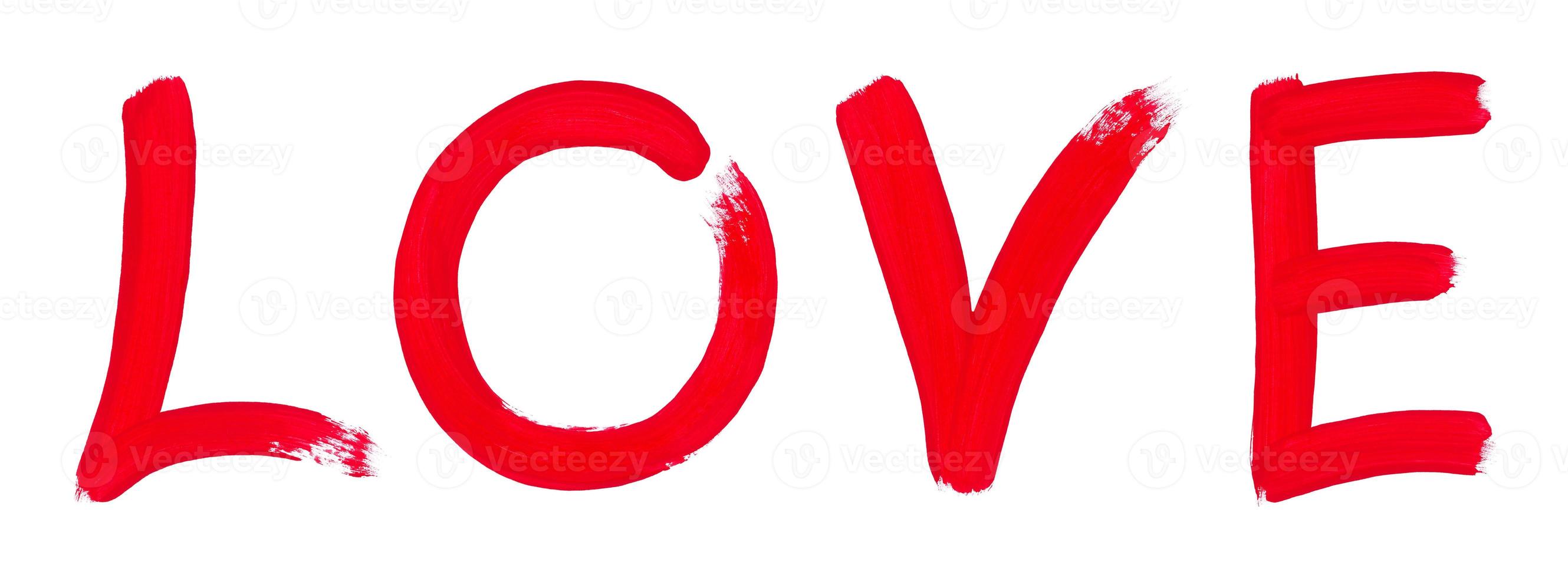 Handwritten red word LOVE, capital letters. Calligraphic brush painted text isolated on white horizontal background. Valentines Day concept, design element for greeting card. photo