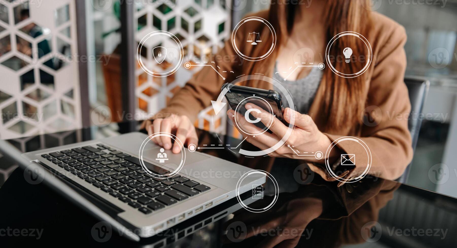Copyright or patent concept, Person hand using laptop computer, tablet and smartphone with virtual screen copyright icon trademark, Creation ownership against piracy. at office photo