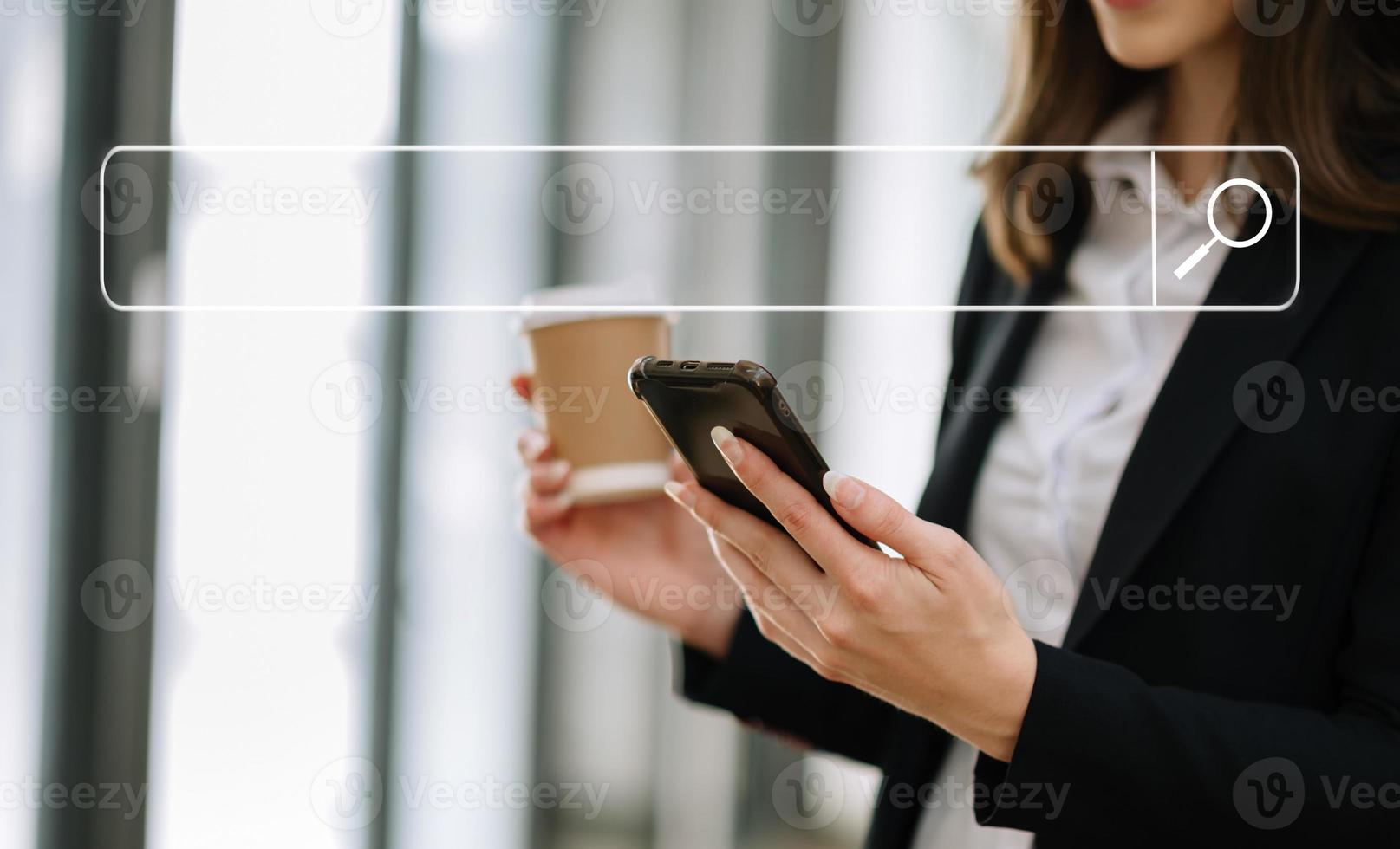 Searching Browsing Internet Data Information Networking Concept with blank search bar.man working with mobile phone and laptop computer VR icon in office photo