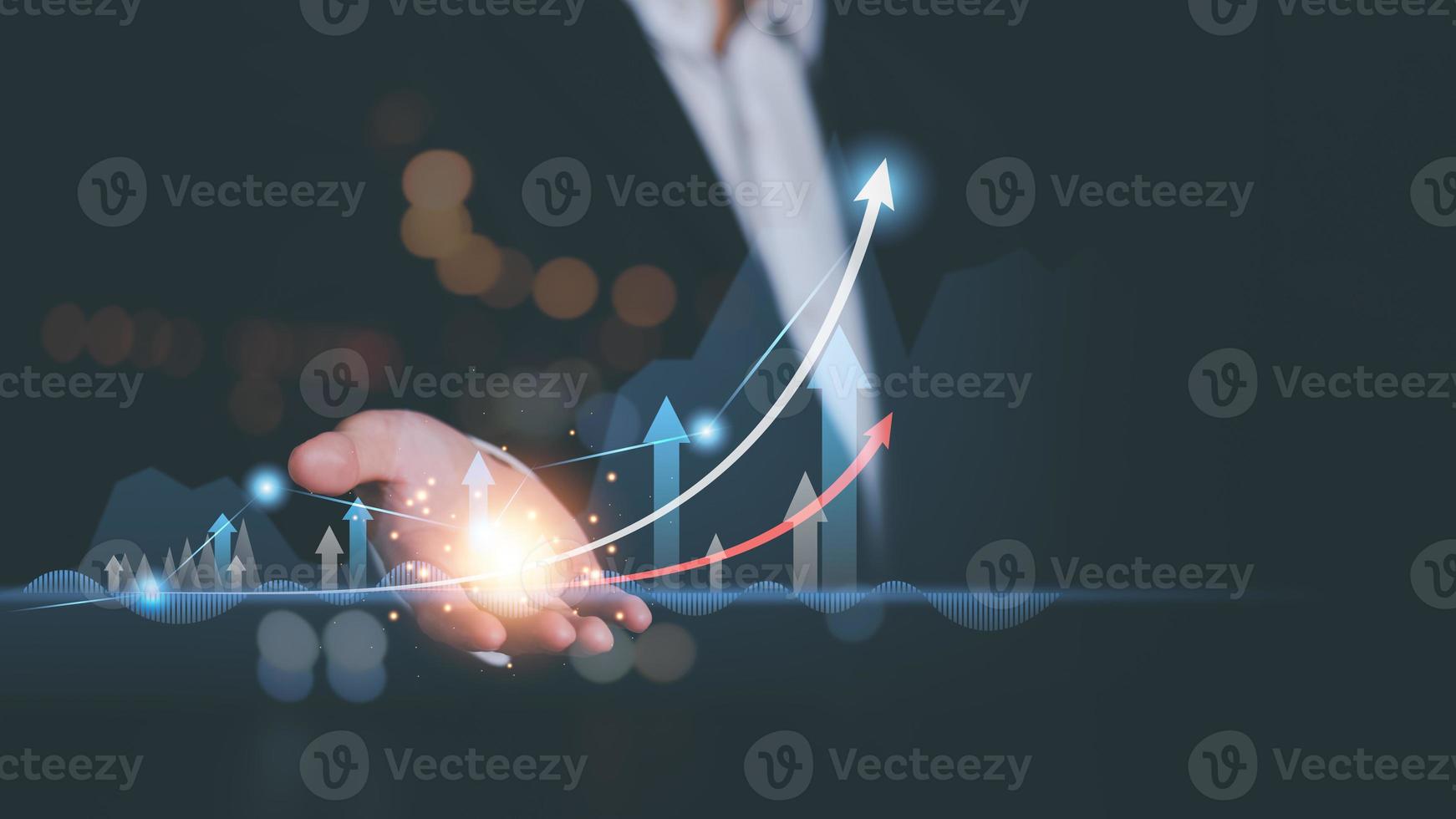 Businessman showing business growth and success graph ,concept of progress in development, financial efficiency and investment with business strategy for goals and opportunities in the industry future photo