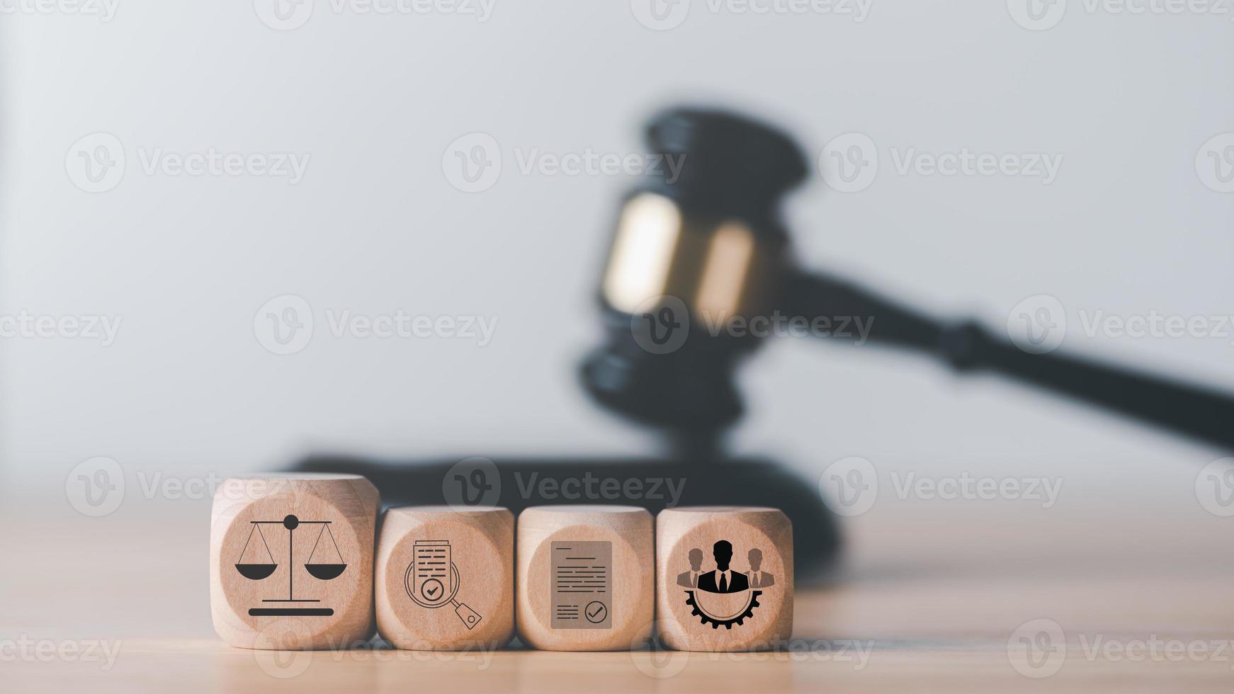 wooden blocks laying on the table,law legal services advice and inspection,legal and justice concepts,document approval,legal Document Icon,labor law,law and defense. photo