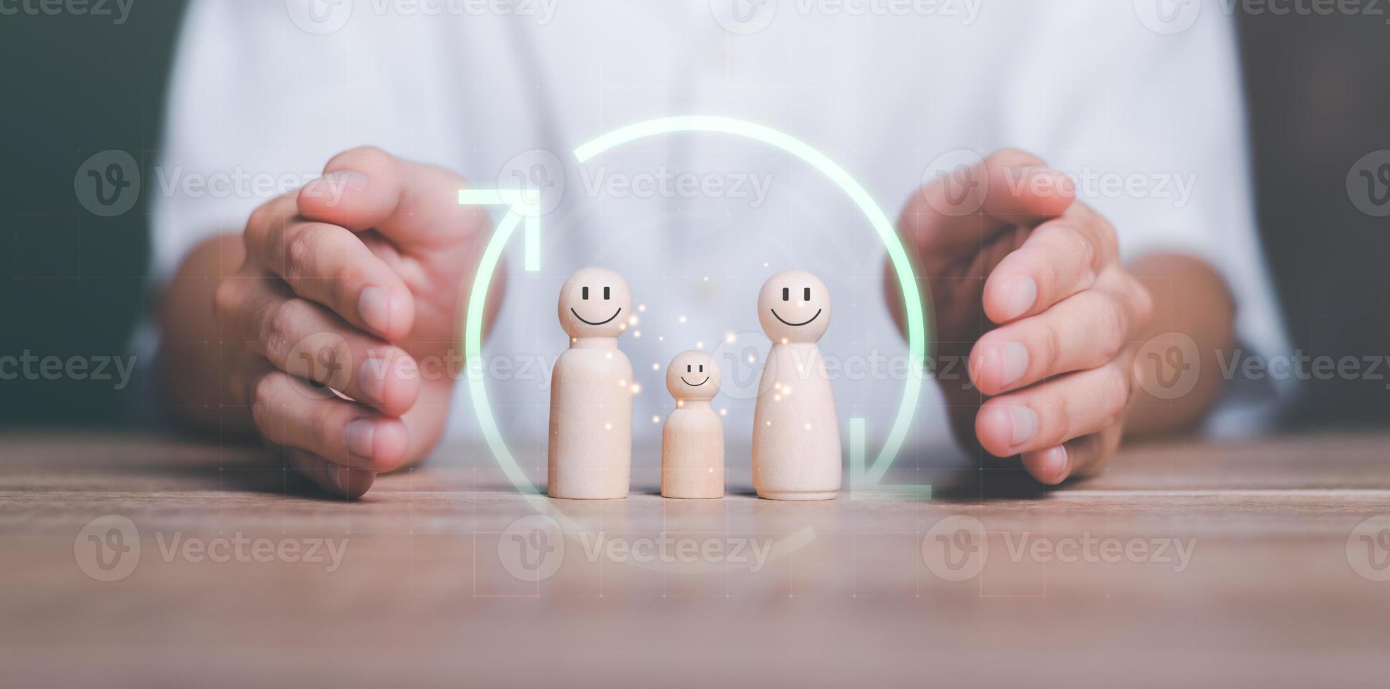 wooden dolls and icons represents the protection and protection of safety,concept of insurance management planning To ensure both health and financial safety,Property and Family Risk Reduction photo