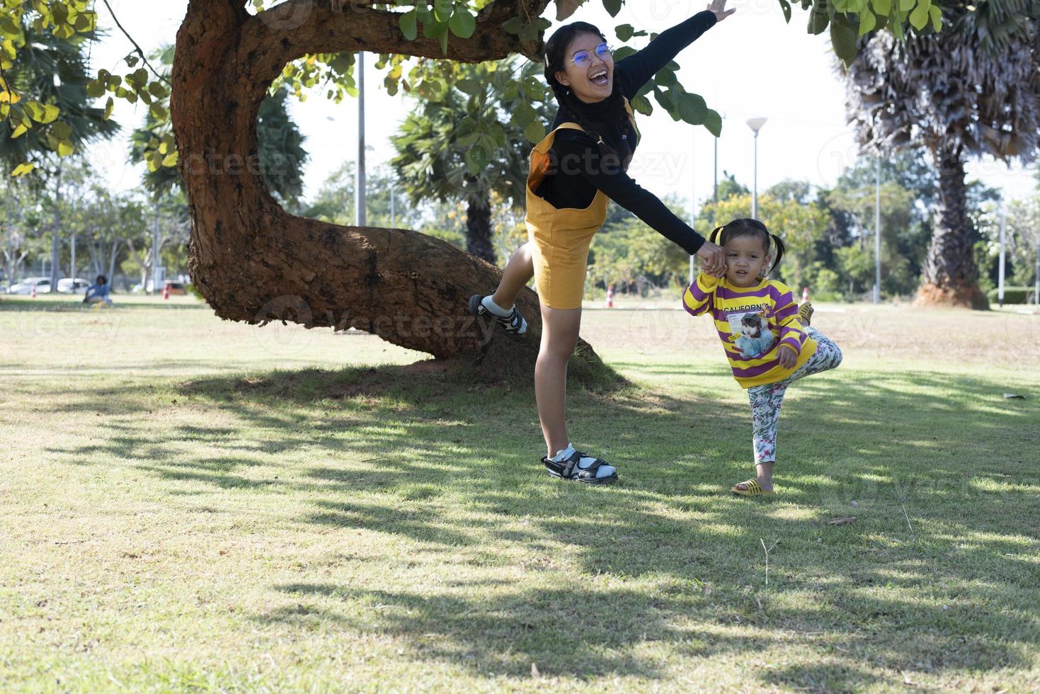 Asian family having fun in the garden Mother and daughter having fun together. photo