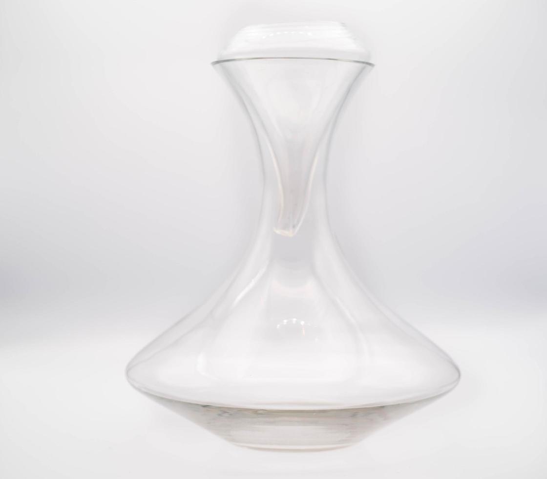 glass decanter on a white background, useful for decanting and oxygenating wine, in this case excellent Italian wine photo