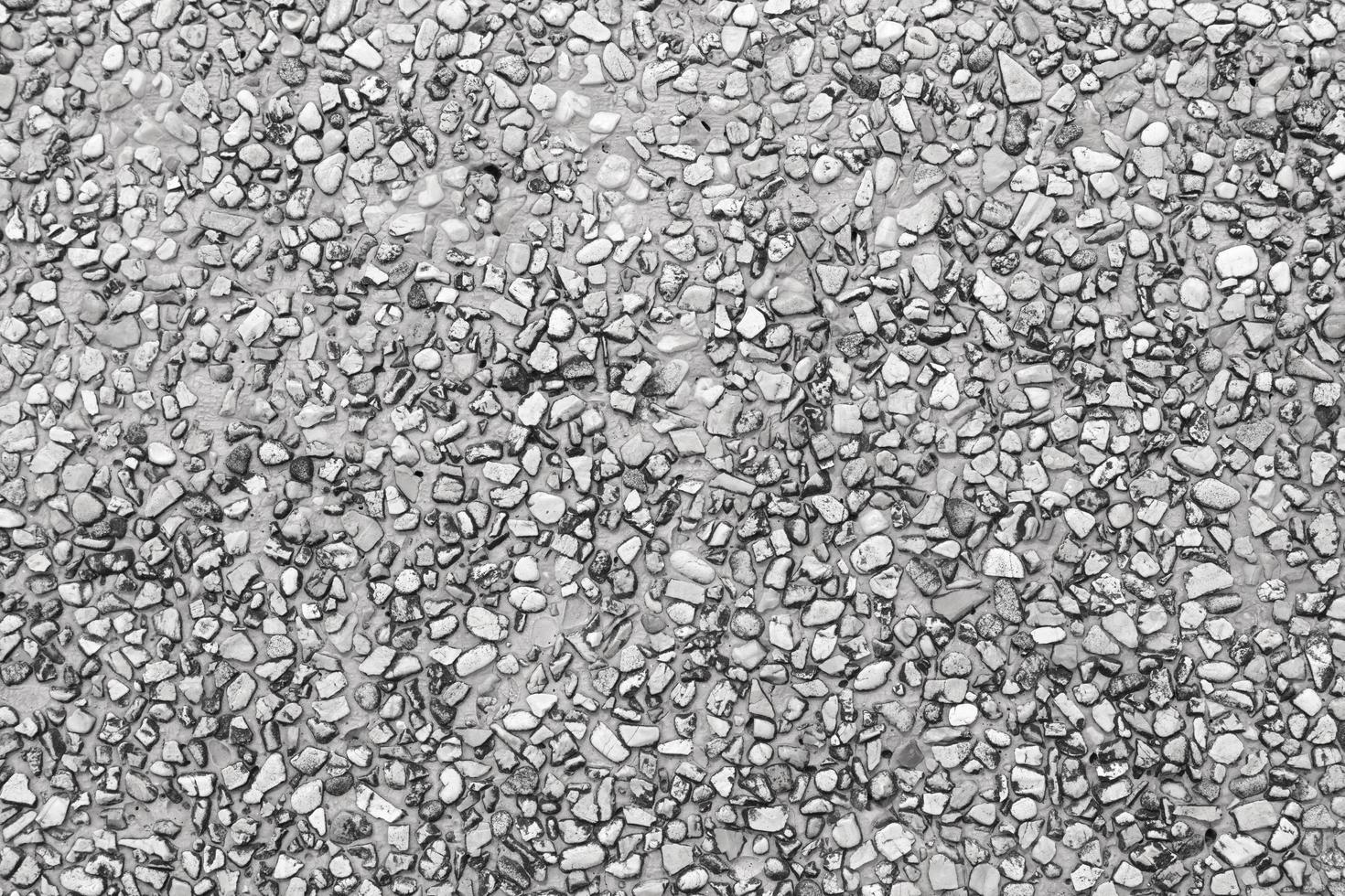 The pattern small black and grey pebbles stone as background. pebbles texture wall and floor. photo