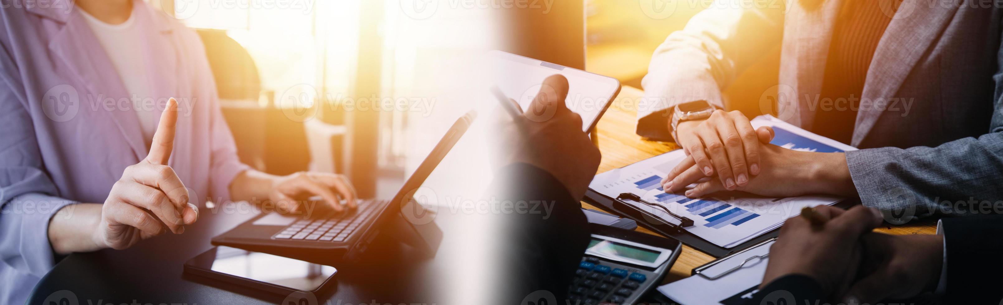 Shot of two businesswoman working together on digital tablet. Creative female executives meeting in an office using tablet pc and smiling. photo