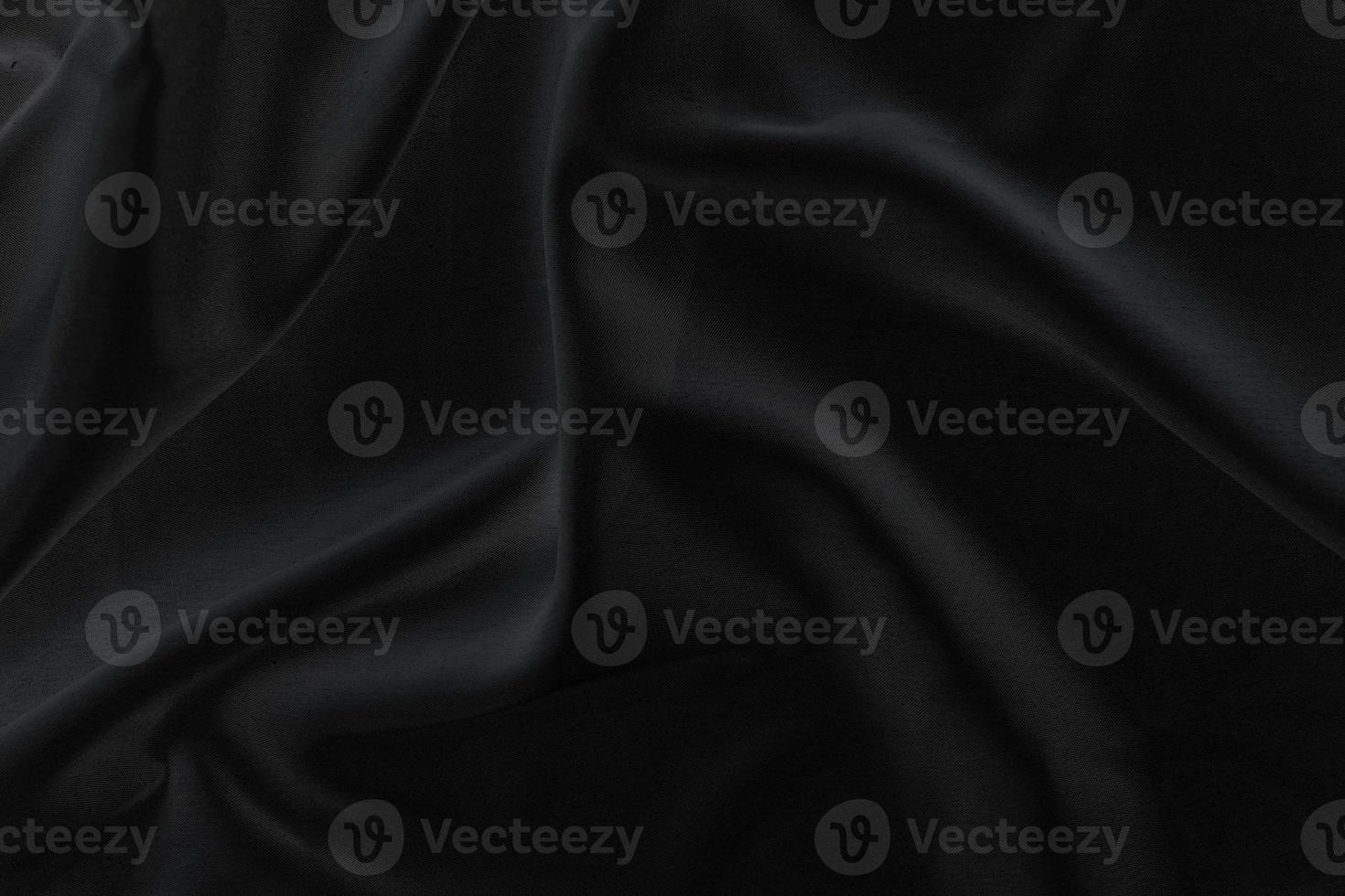 Smooth elegant black silk fabric or satin luxury cloth texture for abstract background photo