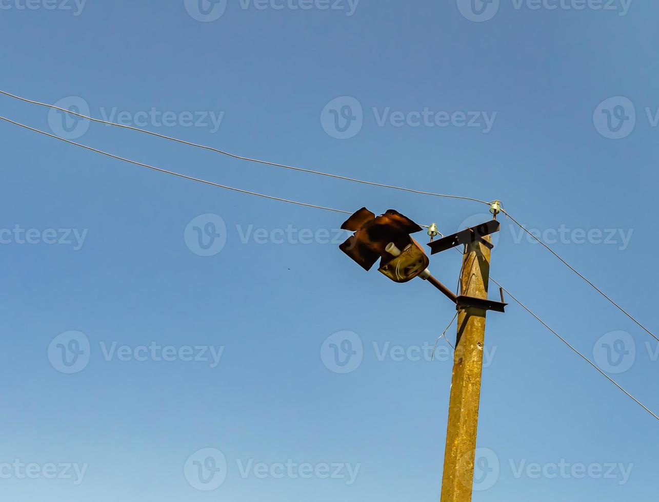 Power electric pole with line wire on colored background close up photo