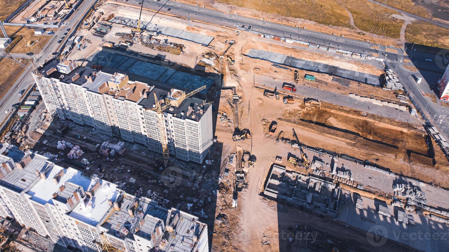 Aerial view of the construction site with unfinished apartment buildings. photo