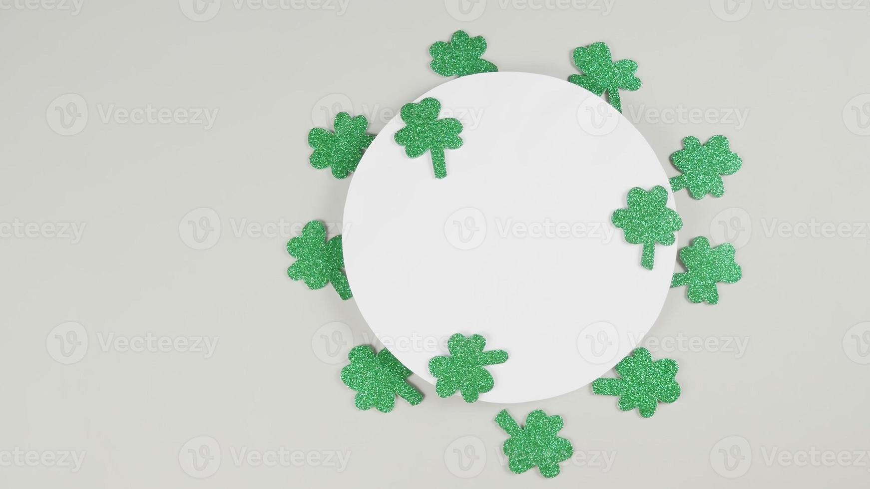 St. Patrick's Day shamrocks on a gray background. View from above. Copy space. 4K photo