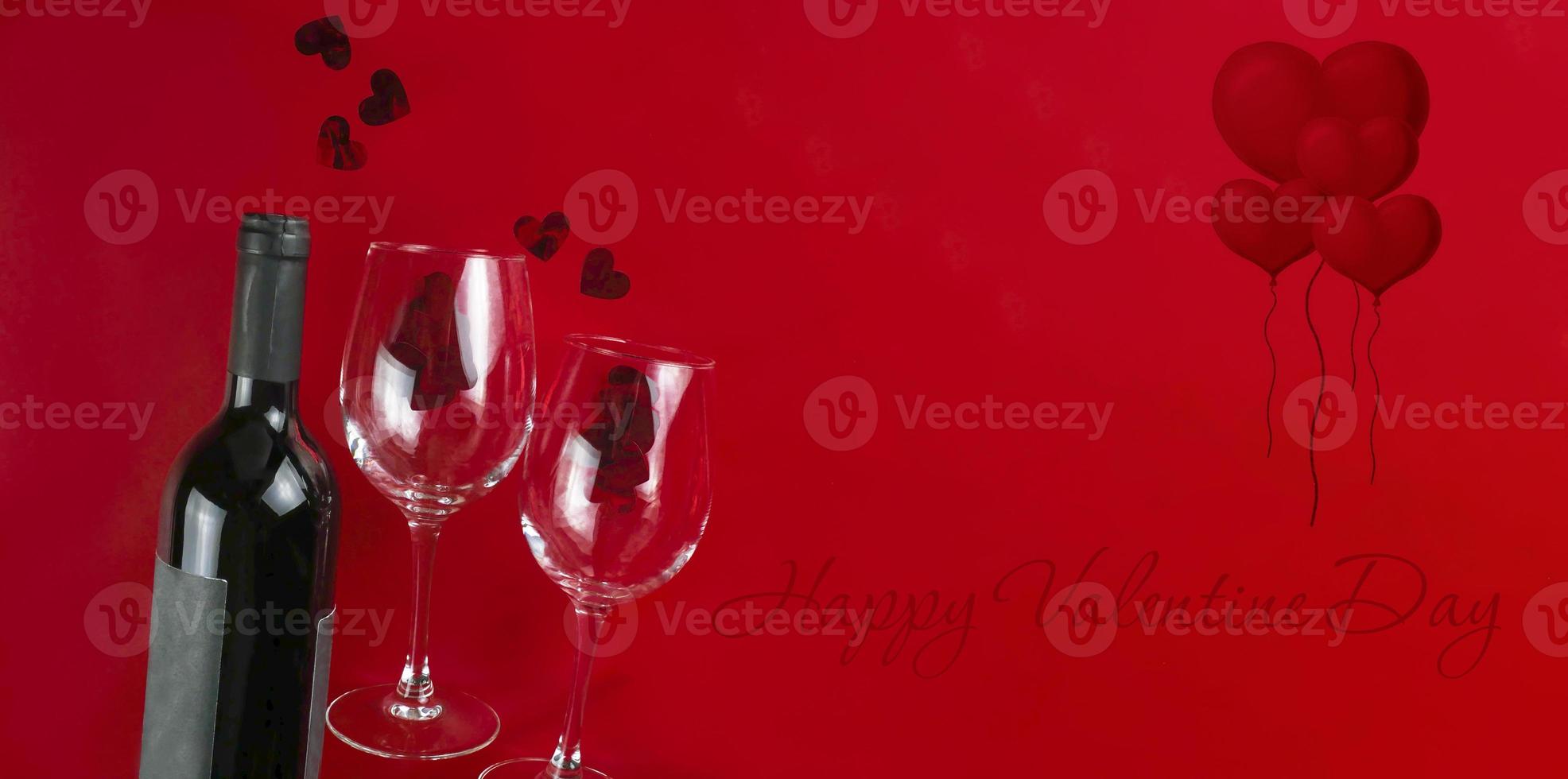 Happy Valentine's Day. Valentine banner. Wine and two glasses on a red background, hearts. Copy space photo