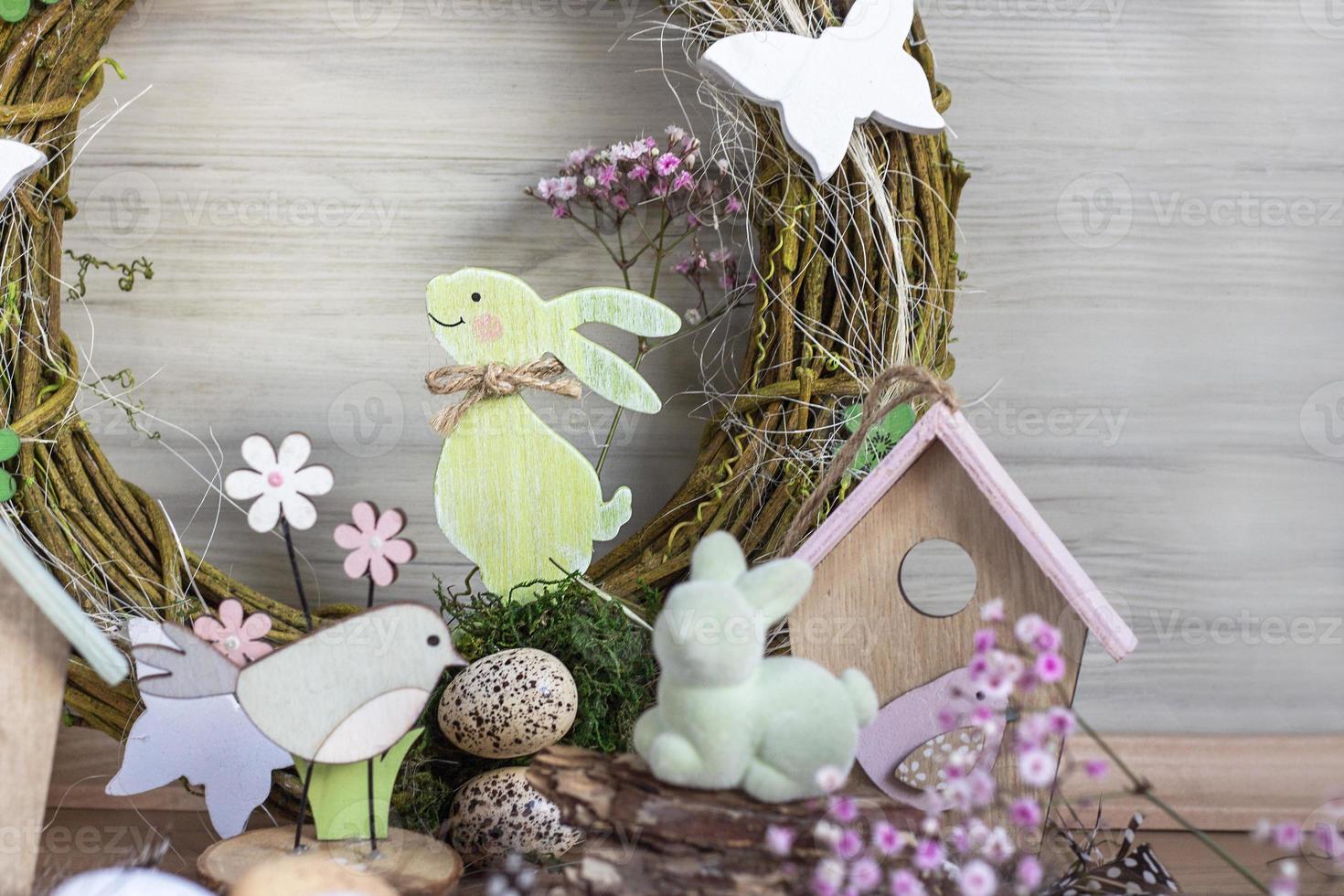 Easter background with Easter wreath and colored Easter eggs and blooming flowers. Easter composition. Easter. copy space photo