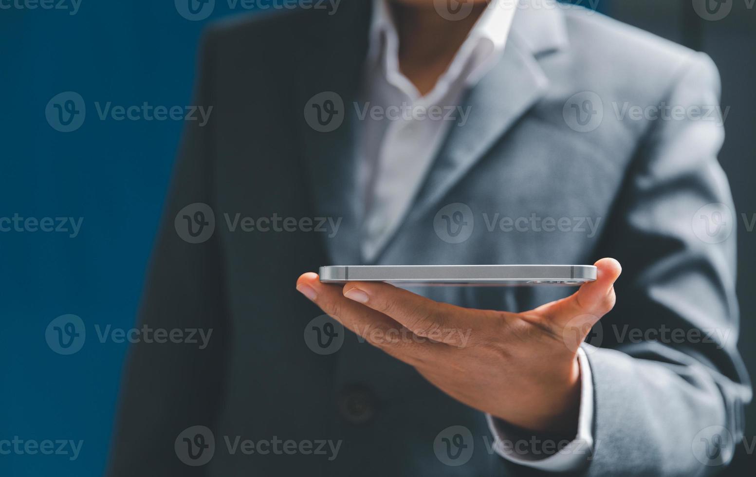 Businesswoman hand holding tablit or smartphone with virtual screen, modern background concept, can put your text with icon bundle, copy space photo