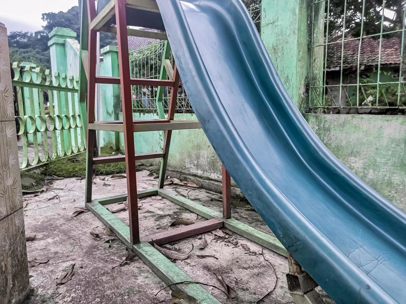 children's slide is not used and abandoned photo