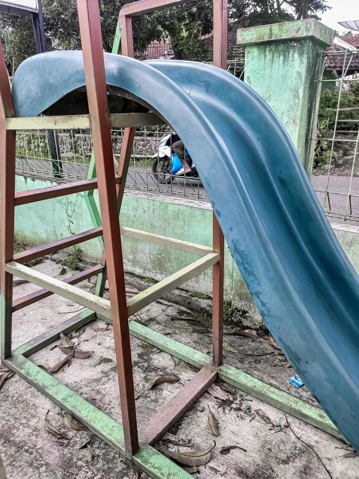 children's slide is not used and abandoned photo