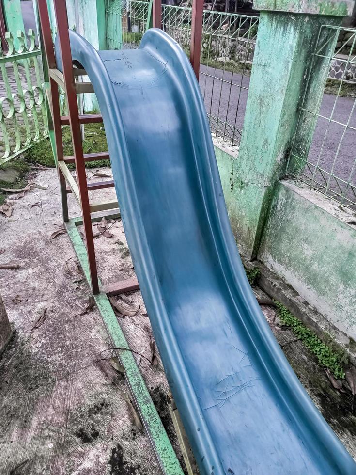 children's slide is not used and abandoned photo