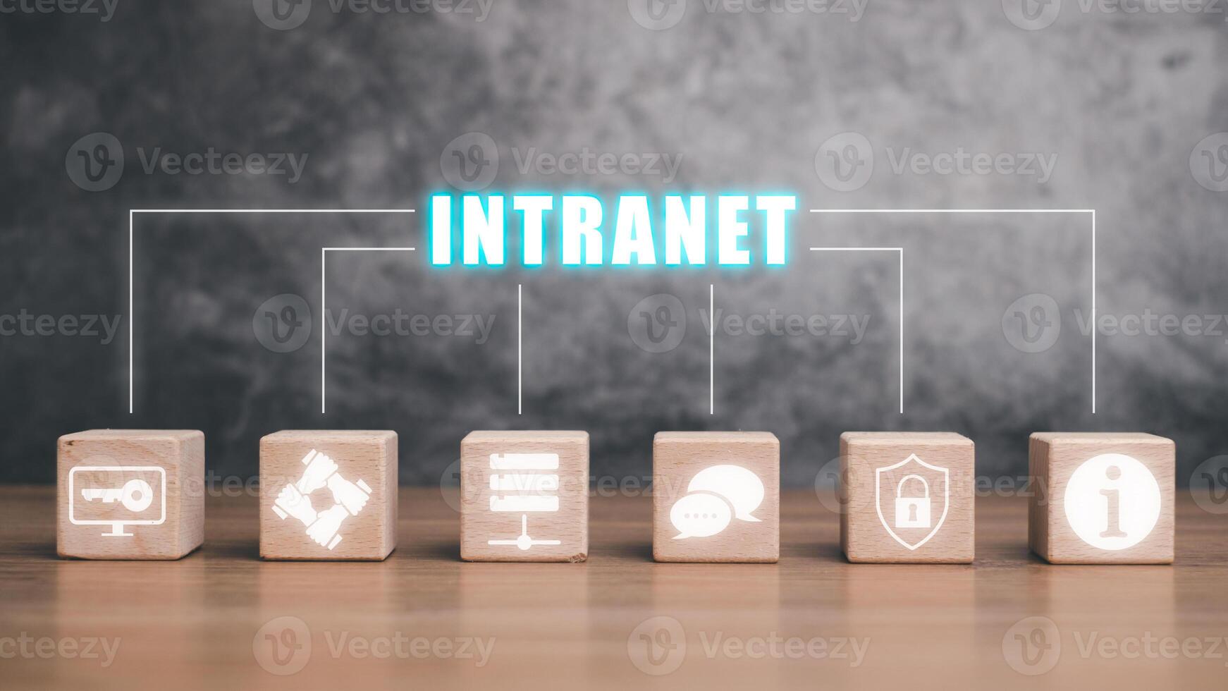 Intranet concept, Wooden block cube on desk with intranet icon on virtual screen. photo