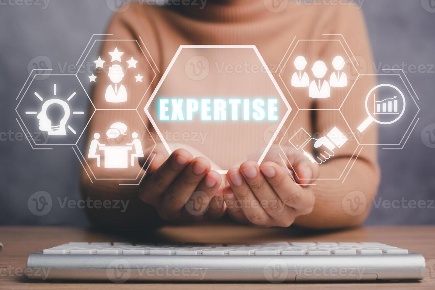 Expertise, expert, consulting, knowledge, team, advice, trust and research concept, Business person hand holding expertise icon on virtual screen, Business and development. photo