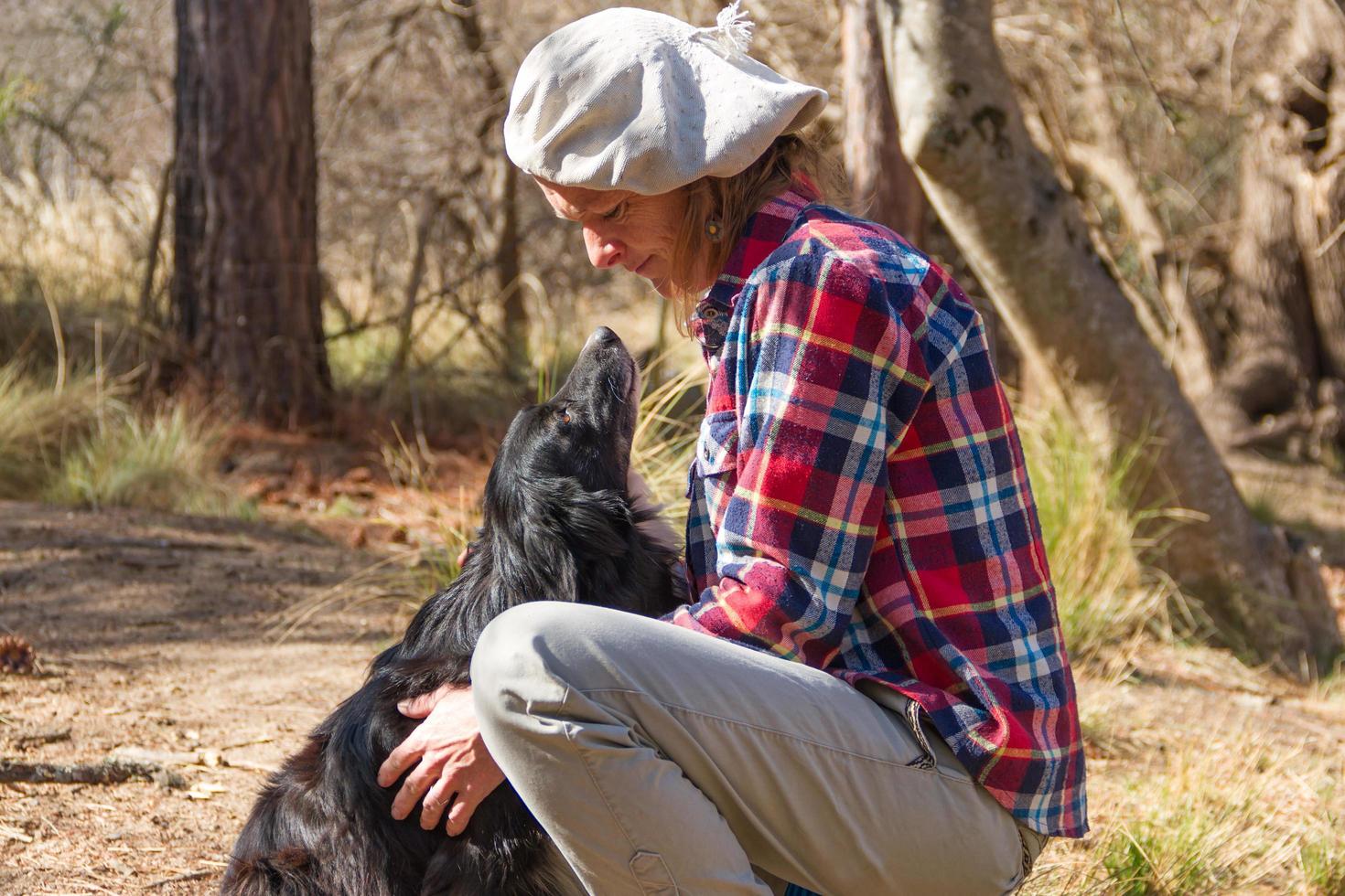 portrait of a woman farm worker with her dog photo