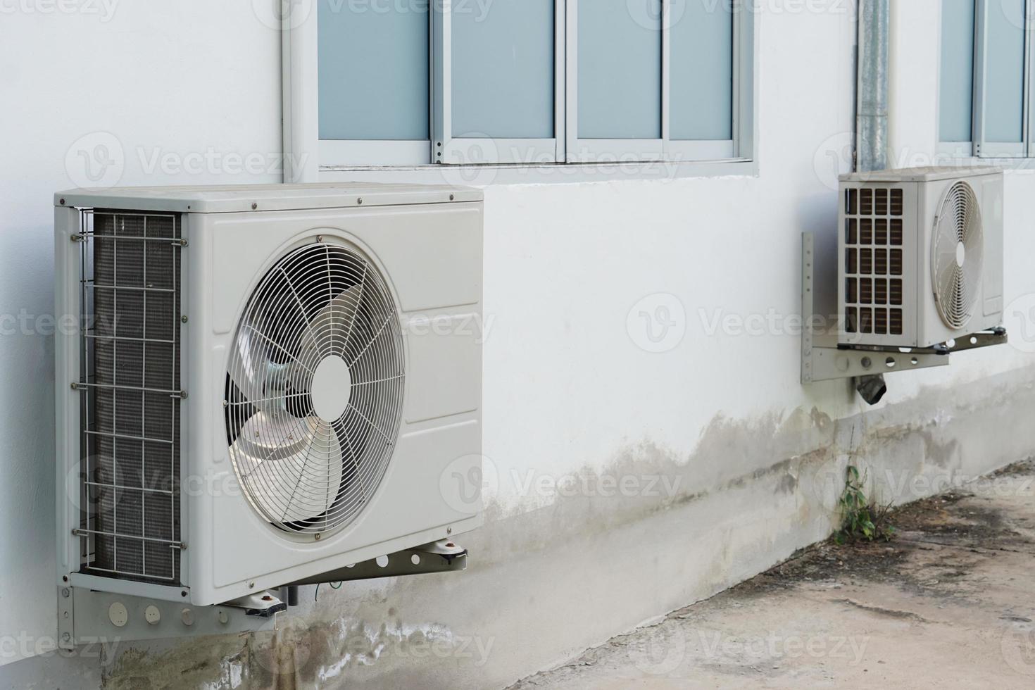 Outdoor air condition  unit compressor install outside house's wall. Concept, appliance for office and house. Various brands to buy in Thailand. Durable and reasonable price . photo