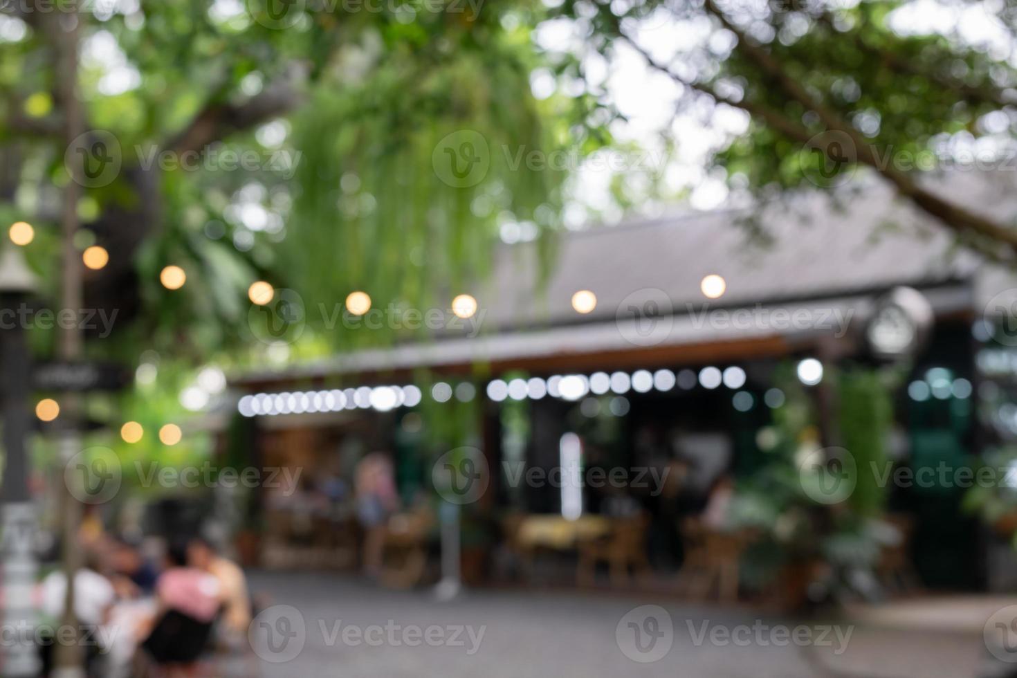 Blur coffee shop or cafe restaurant with abstract bokeh light image background. photo