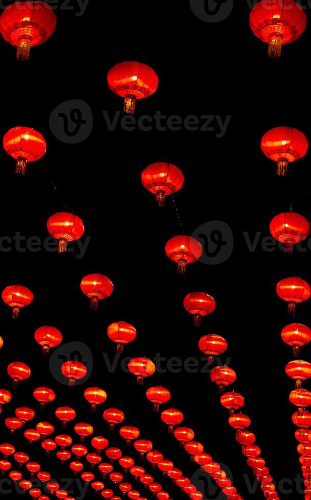 Chinese lantern in new year festival, red lanterns are hung as pattern,black background,Chinese new year concept. photo