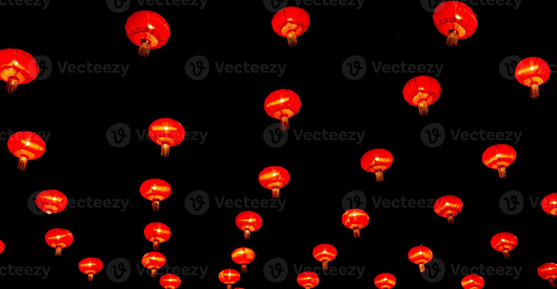 Chinese lantern in new year festival, red lanterns are hung as pattern,black background,Chinese new year concept. photo