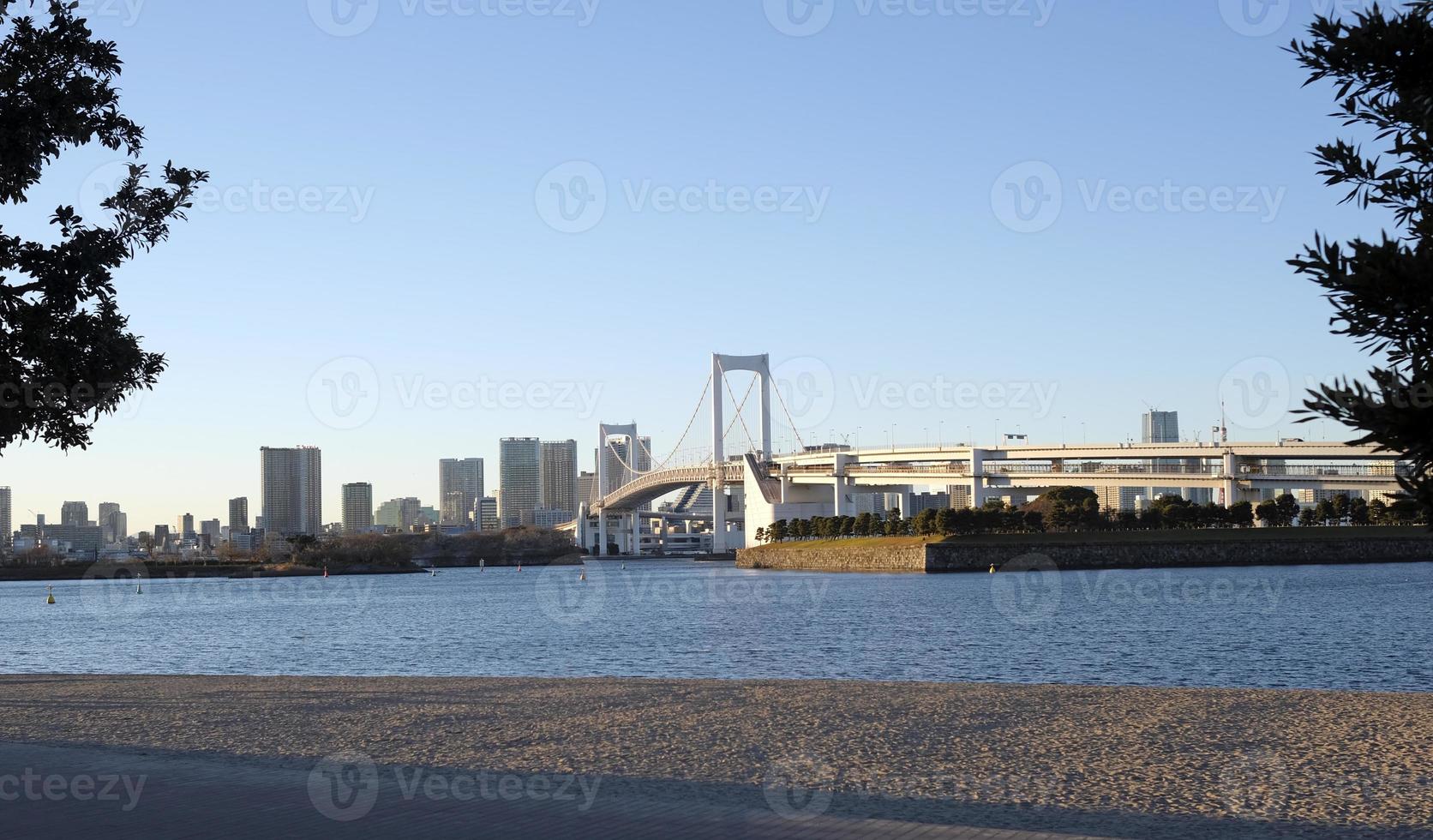 Rainbow Bridge going over Tokyo Bay in Tokyo, Japan photo