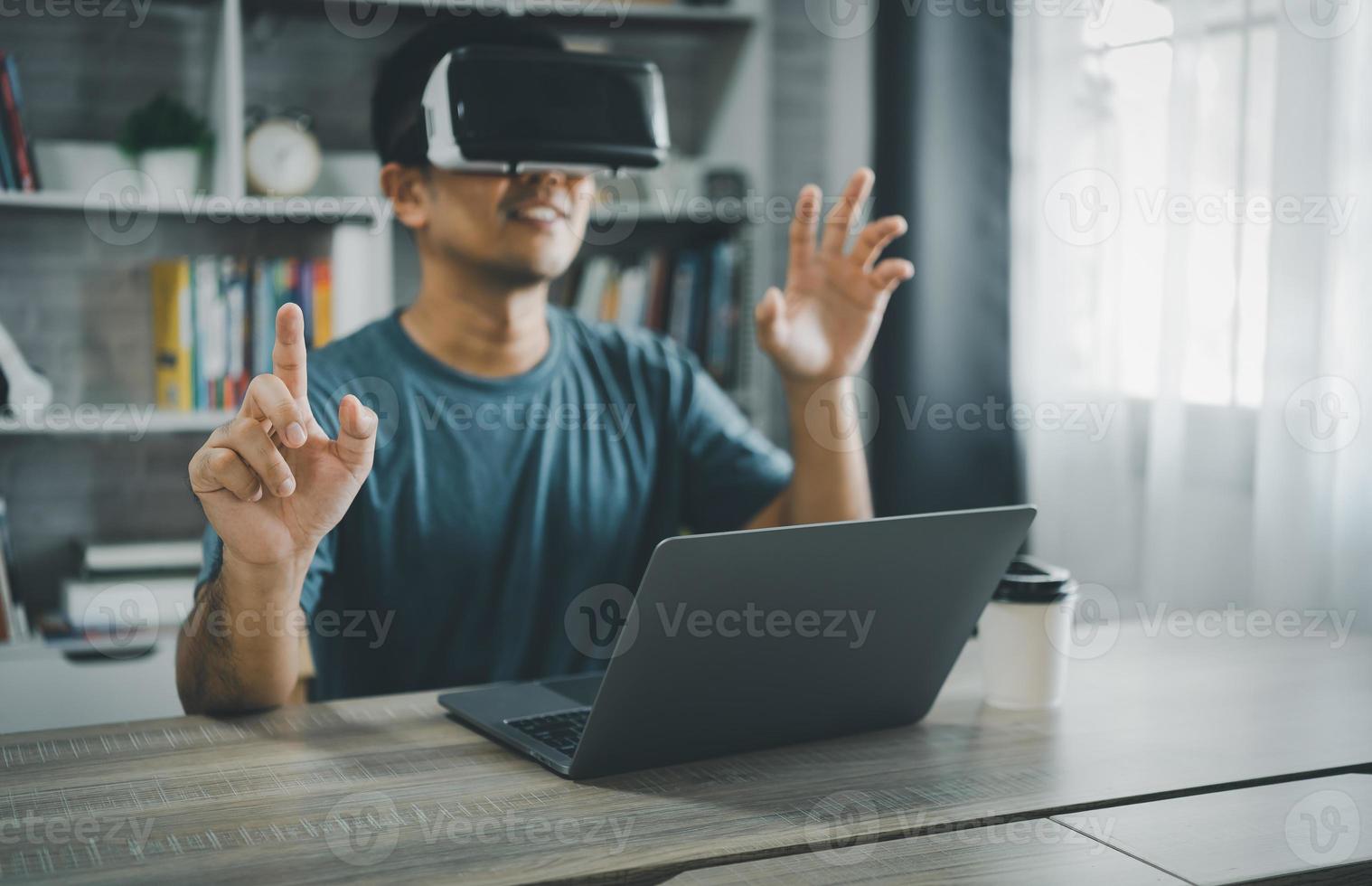 Asian man wearing VR glasses virtual global Internet connection metaverse, point finger use finger touch digital unlock, Metaverse technology management, online access to database, future technology. photo