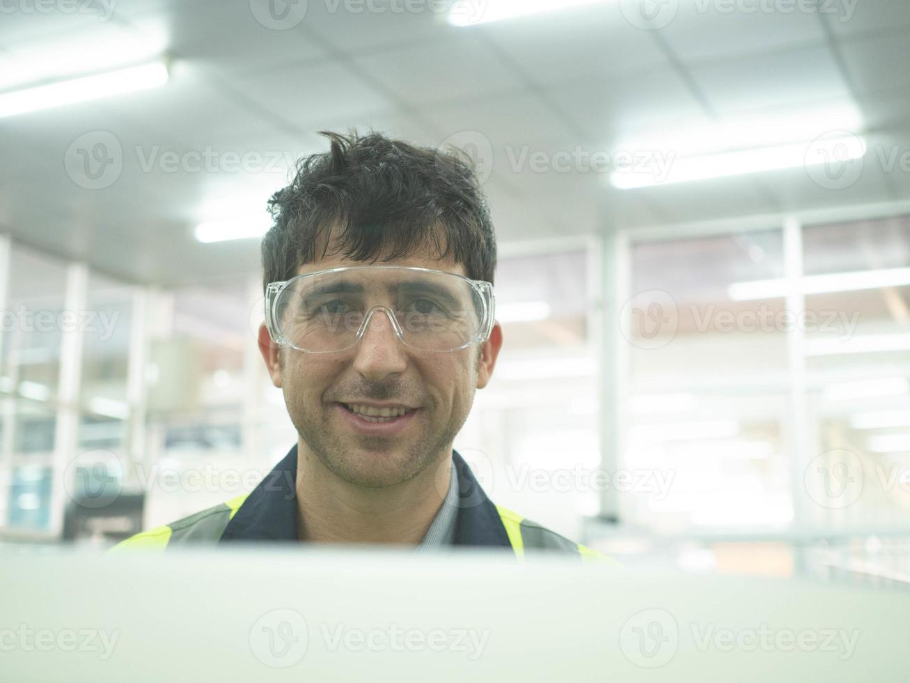 male engineer labor staff employee factory uniform wear glasses look at camera happy smile portrait work job occupation industry machinery maintenance heavy construction technical equipment specialist photo