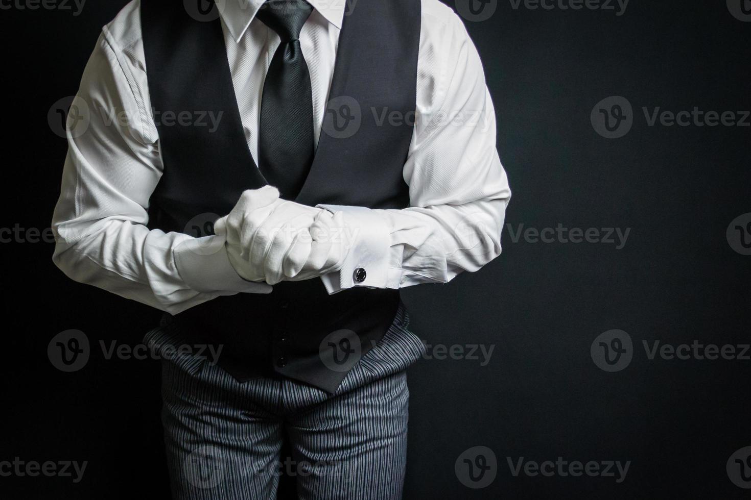 Portrait of Butler or Waiter in White Gloves Eager to Be of Service. Concept of Service Industry and Professional Courtesy. photo