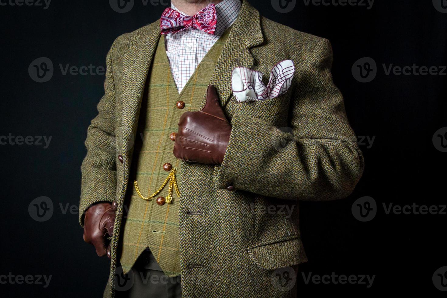 Portrait of Gentleman in Tweed Suit Standing Proudly. Concept of Classic and Eccentric British Gentleman photo