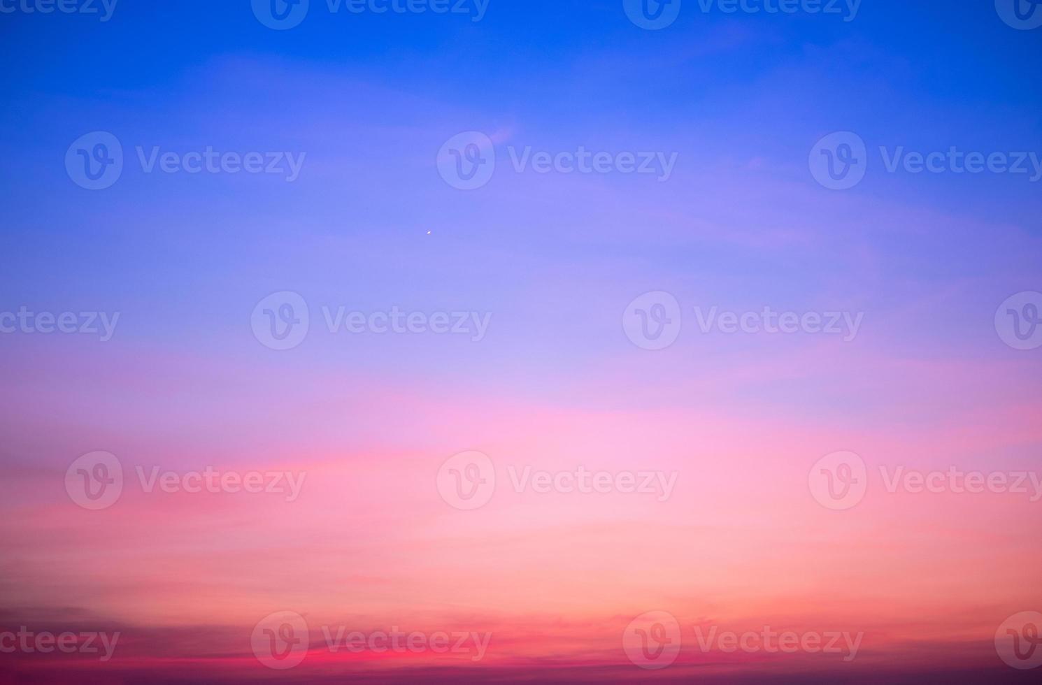 beautiful gradient orange and ranibow colour clouds and sunlight on the blue sky perfect for the background, take in everning,Twilight photo