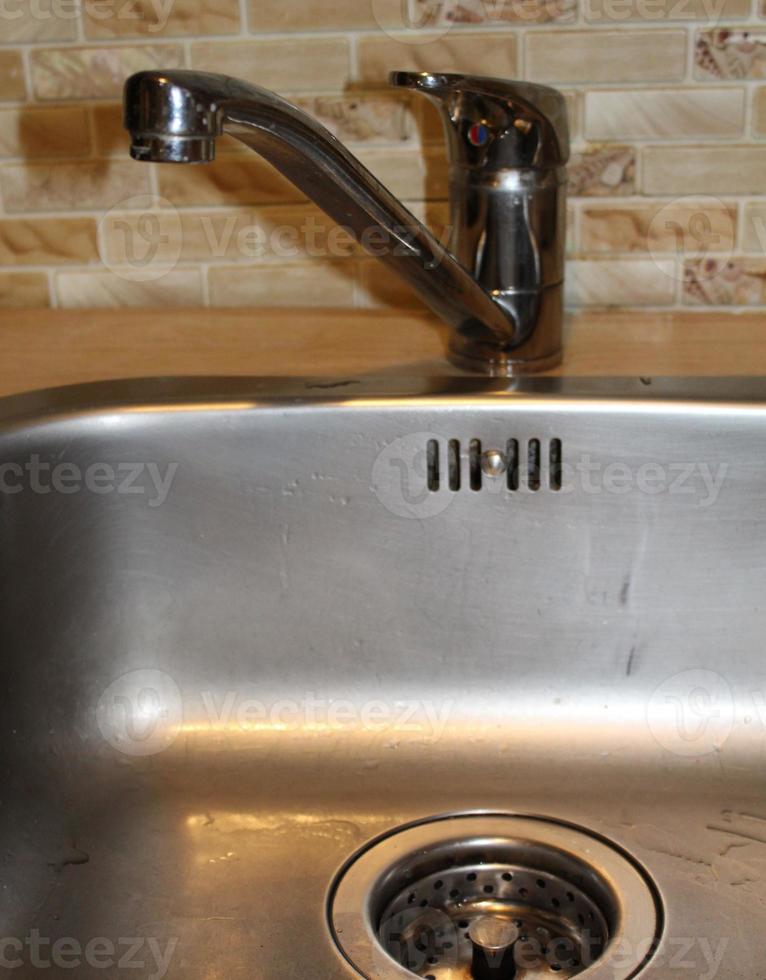 Modern kitchen sink, orange tone photo