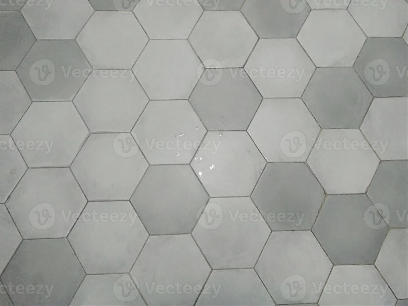 Grey hexagon marble tiles with white grout, Seamless interior decoration bavkground. photo