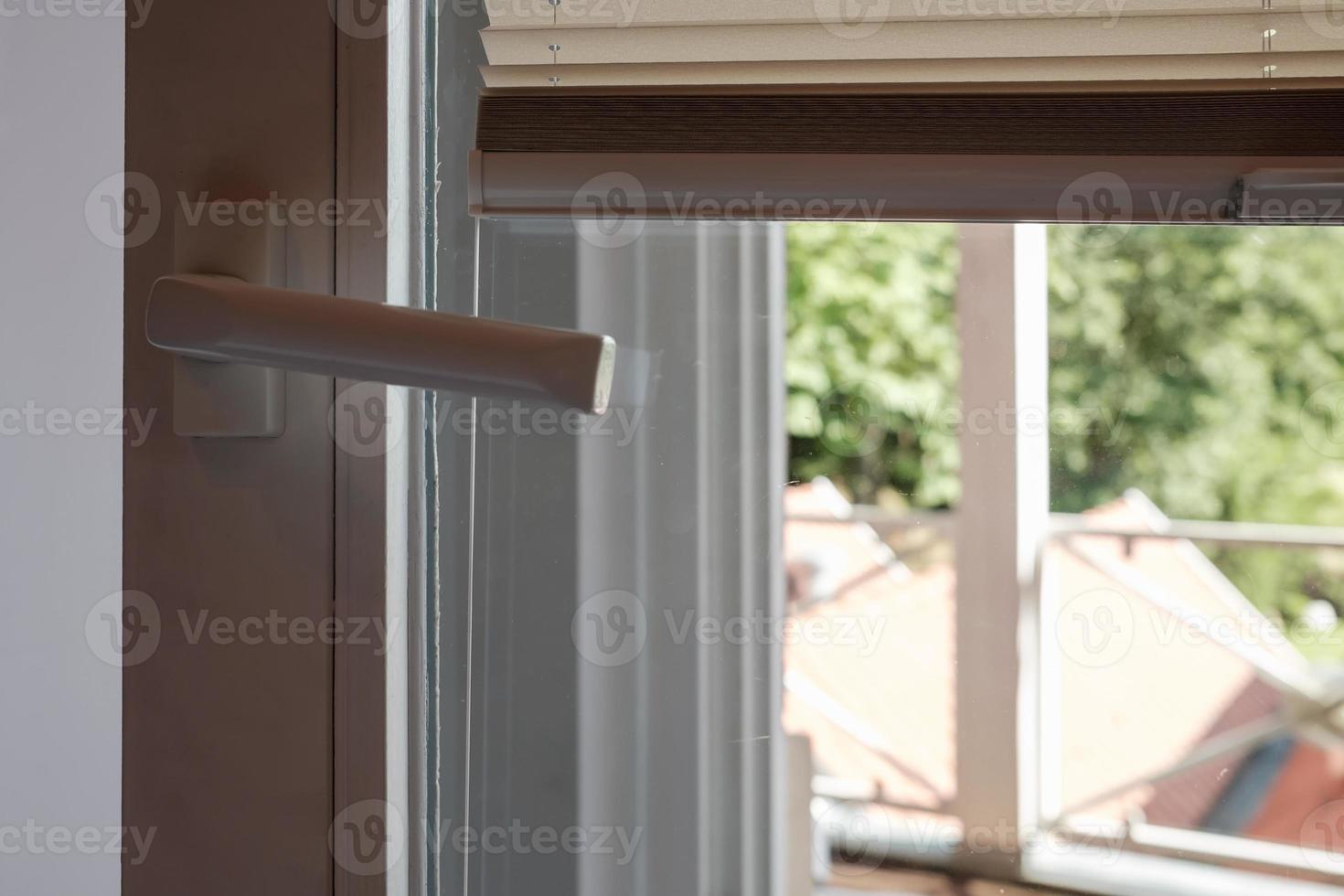 PVC door with raised blinds that protect from the sun. photo
