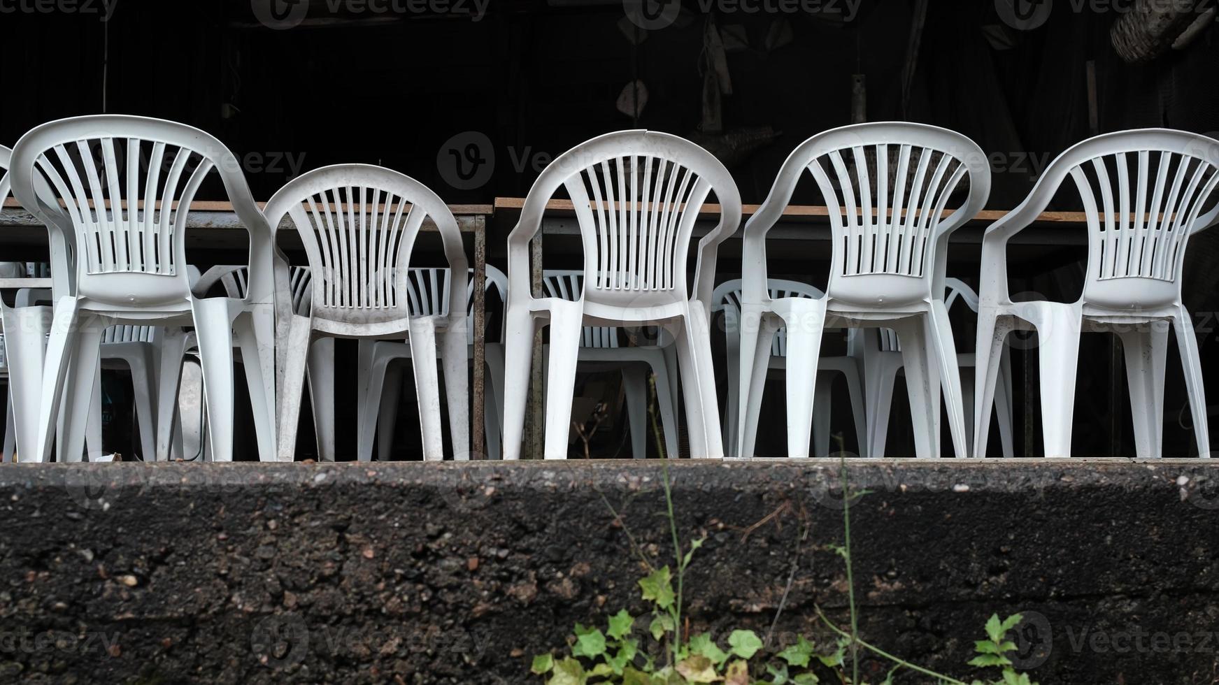 Closed restaurant. Empty chairs and tables on the terrace, in a tourist town. photo