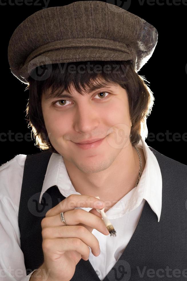 Young man with vintage clothes smoking photo