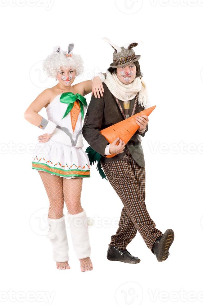 couple with carrot dressed as rabbits photo