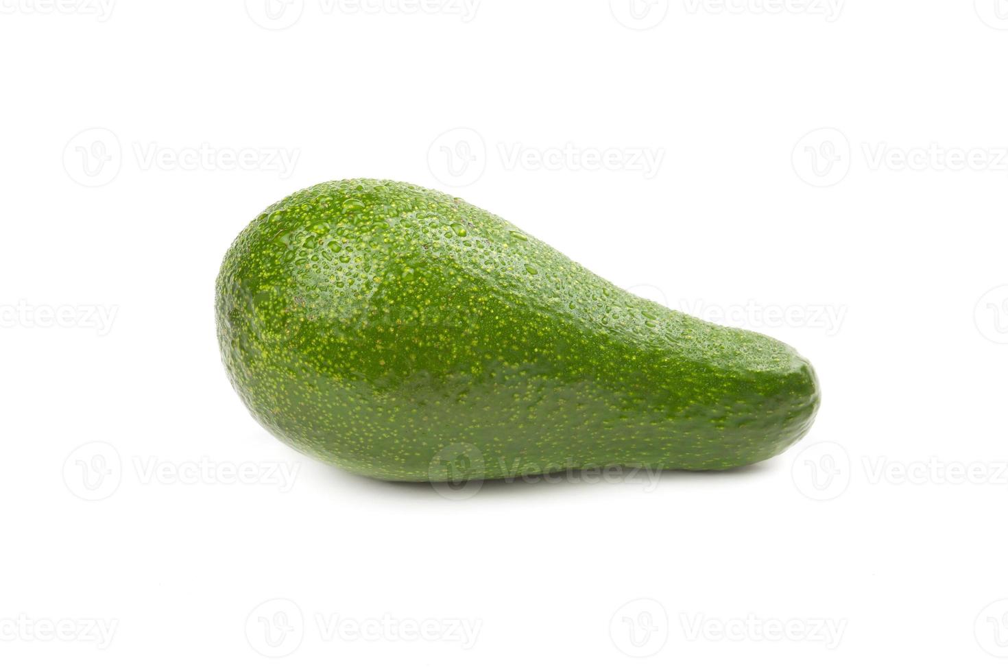 Green avocado with water drops photo