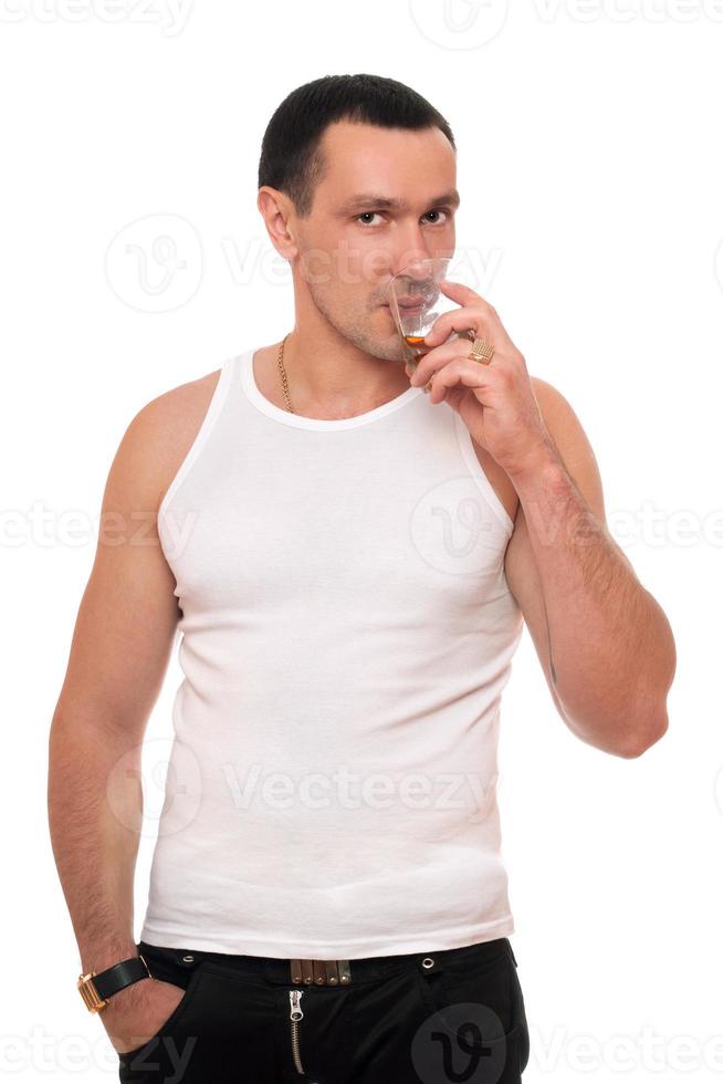 Man with a glass of whiskey photo