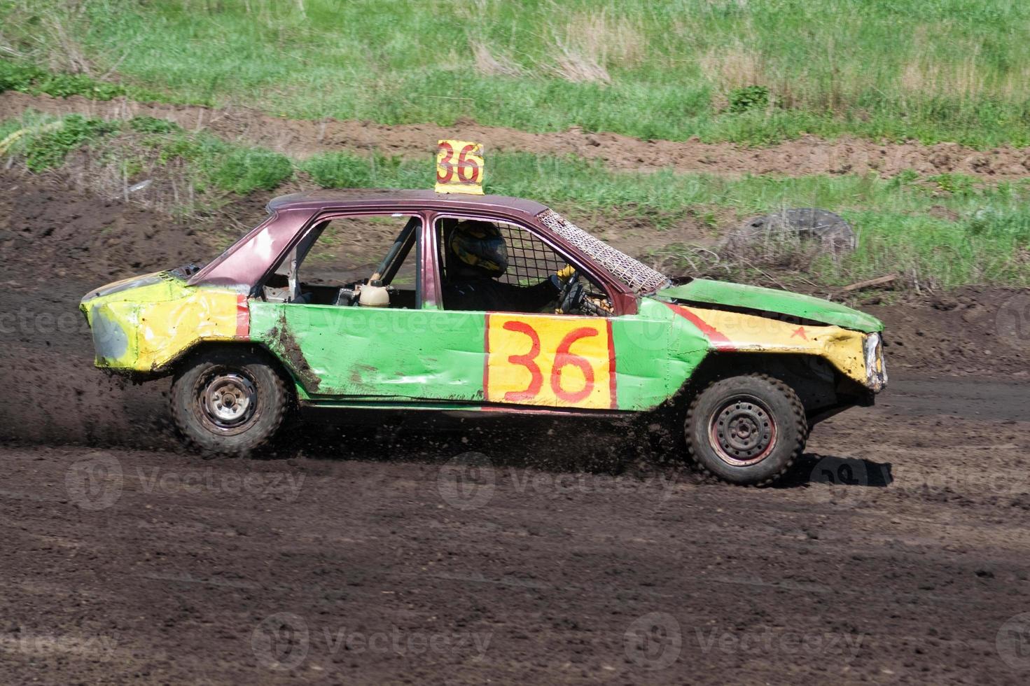 Race for survival. Green yellow car photo