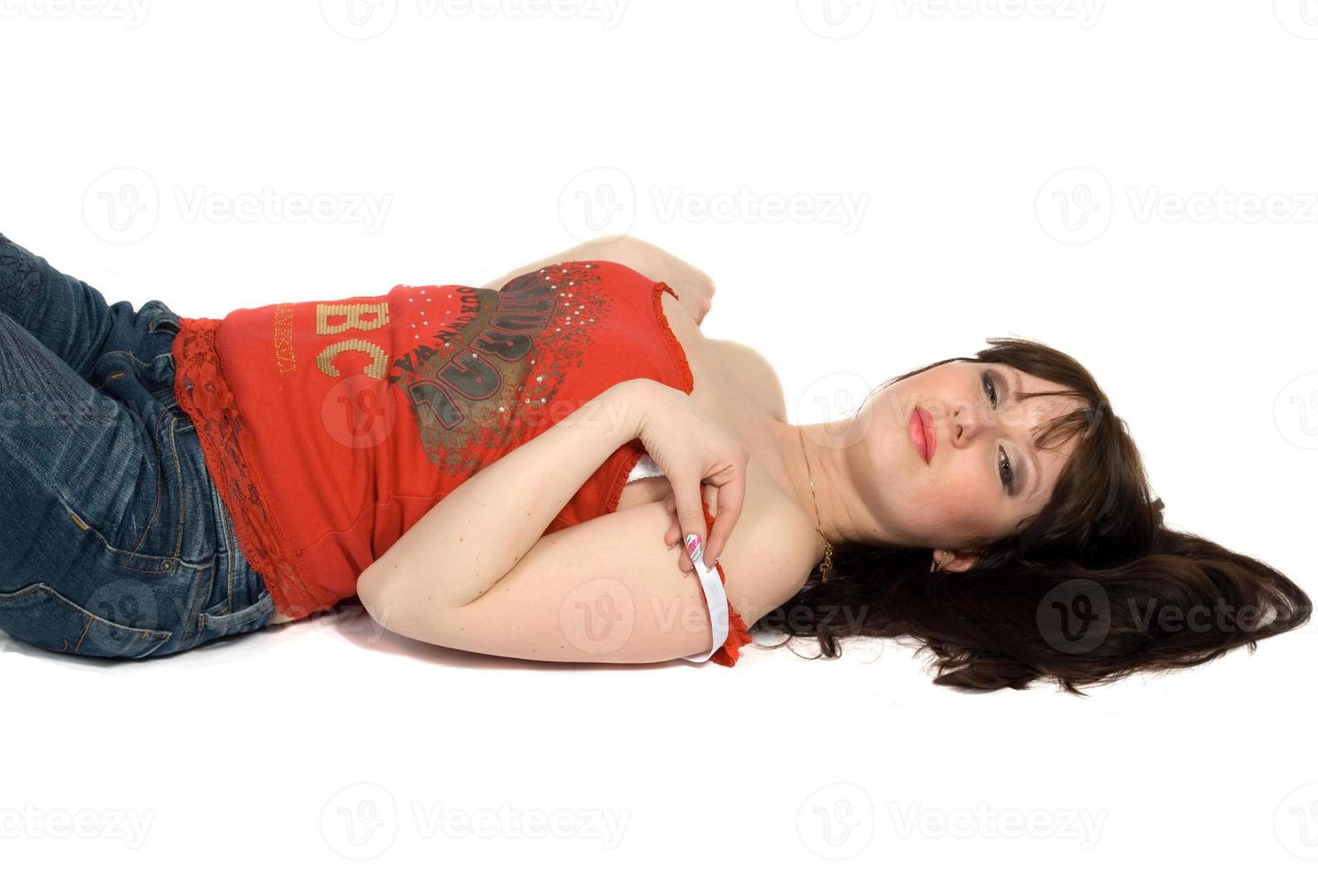 The young woman lays on a back. Isolated. photo