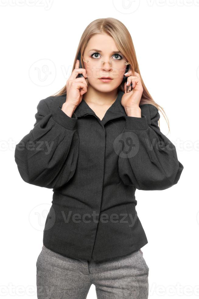 Portrait of tired young blonde in a gray business suit photo