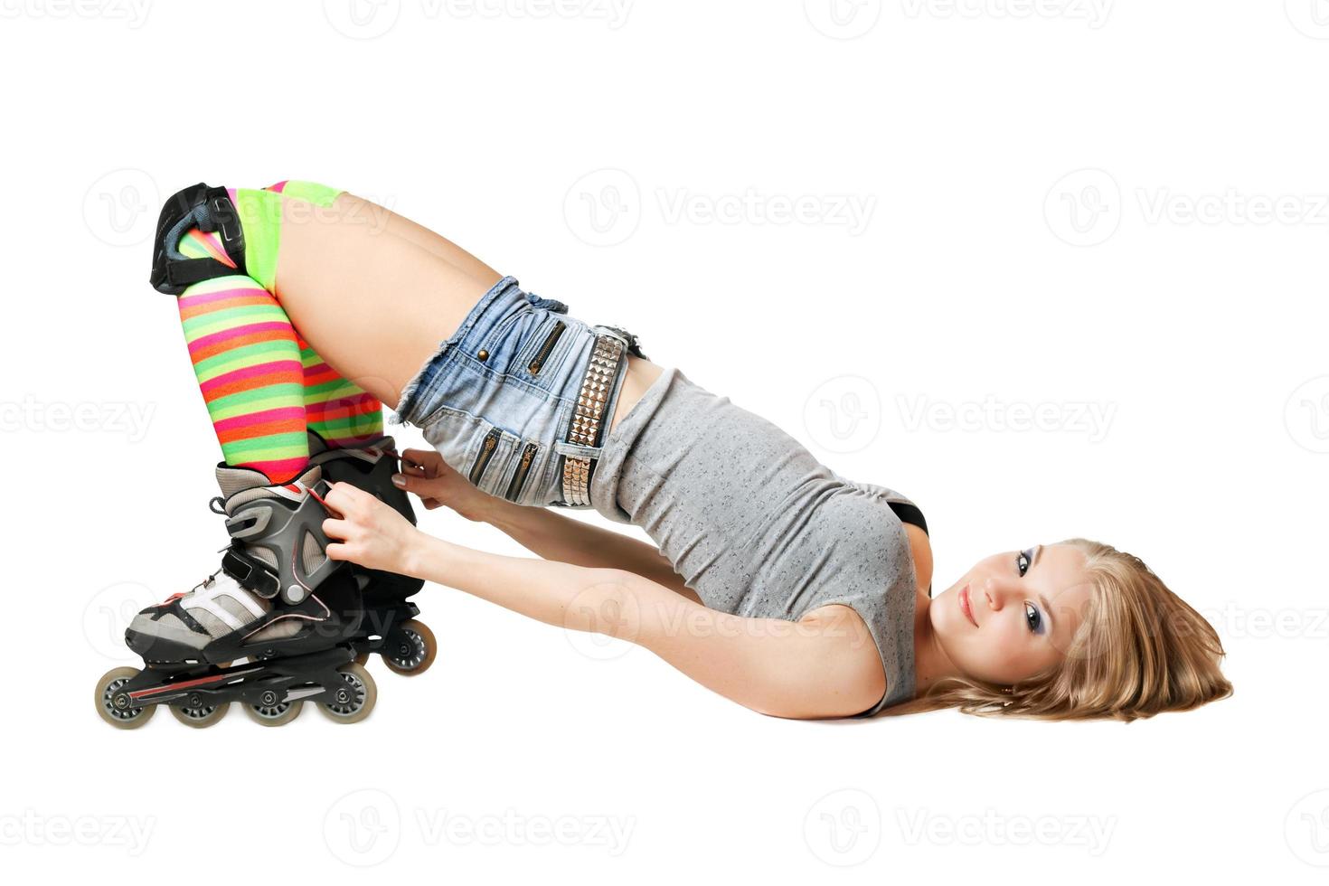 Lying pretty girl in roller skates photo