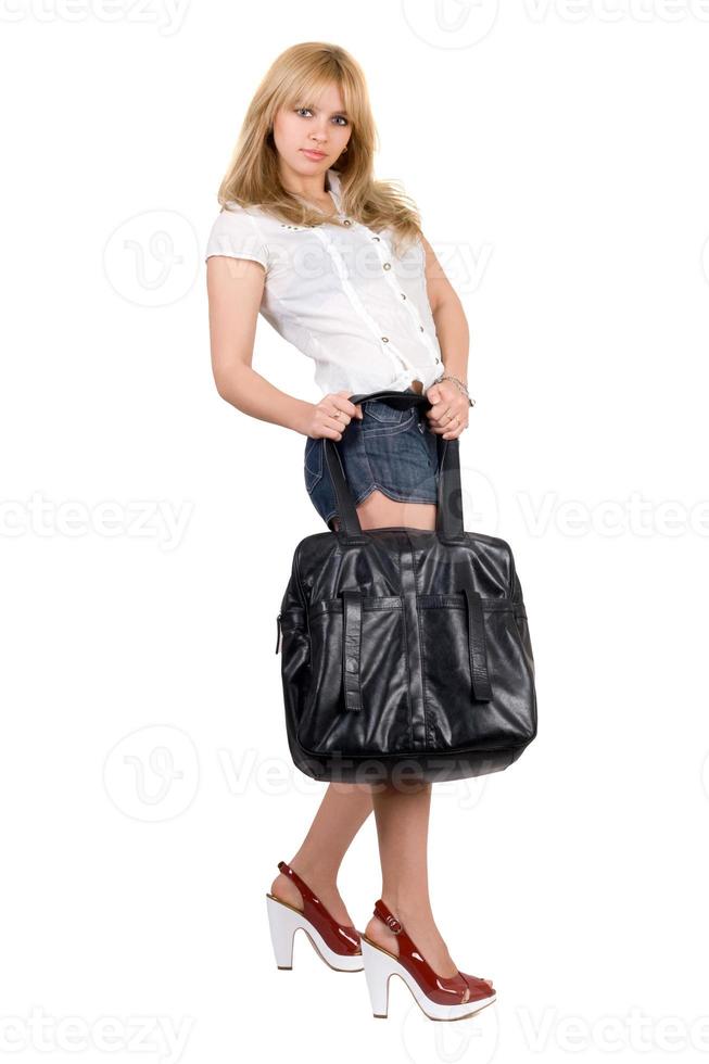 Beautiful girl with a black handbag. Isolated photo