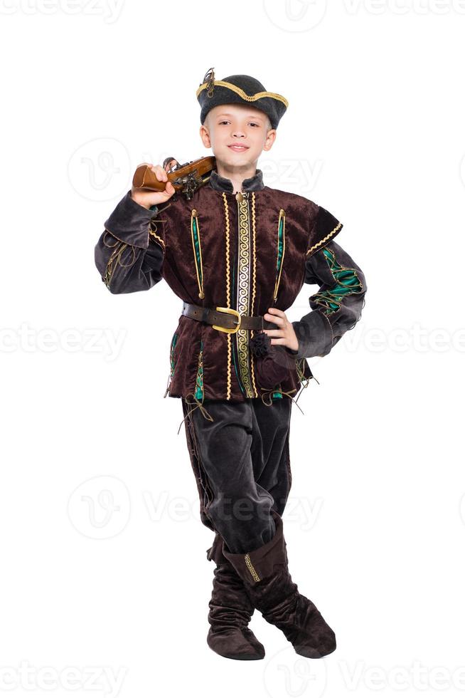 Boy posing in a suit of medieval hunter photo